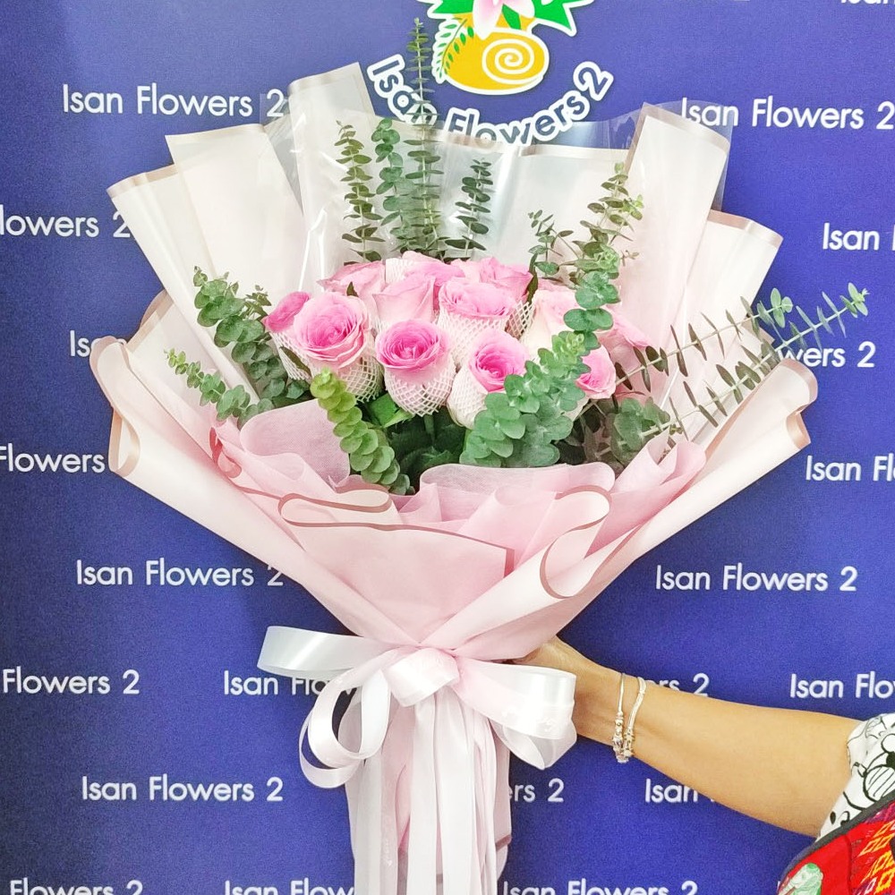 18 big pink roses in pink round bouquet a