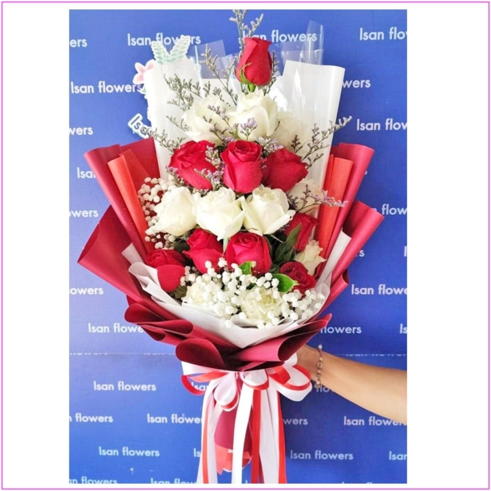 9 red and 9 white big roses in red and white tall bouquet a