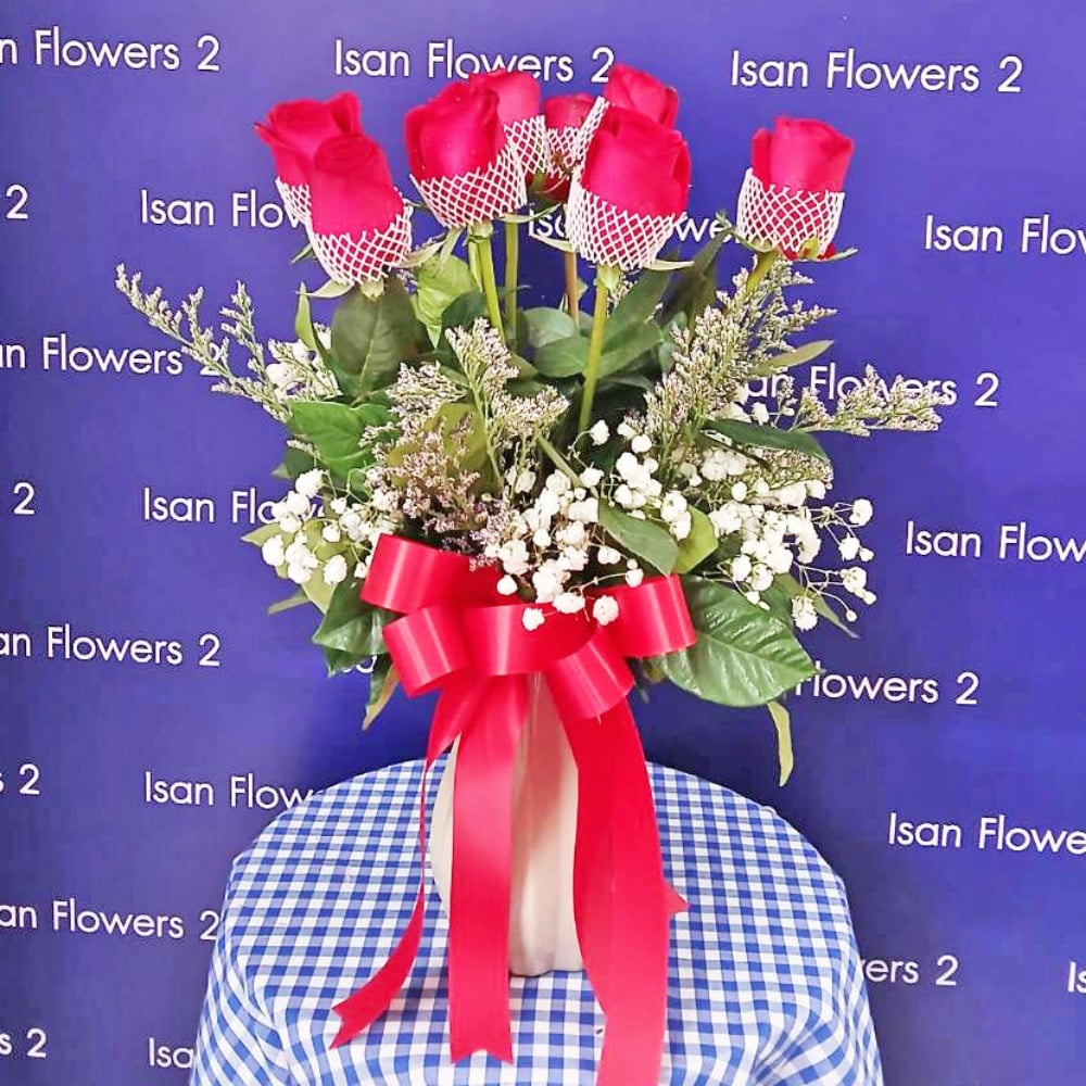9 red roses with filler in vase b pre
